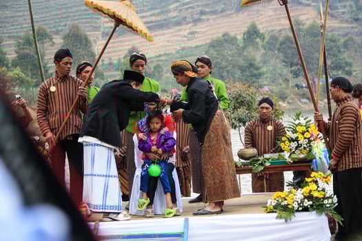 Dieng, Indonesia - August 1, 2015. Dieng Culture Festival, Tourists follow the dreadlocks procession during the Dieng Culture Festival event at Dieng, Banjarnegara district, Central Java photo
