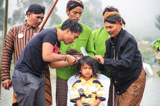 Dieng, Indonesia - August 1, 2015. Dieng Culture Festival, Tourists follow the dreadlocks procession during the Dieng Culture Festival event at Dieng, Banjarnegara district, Central Java photo