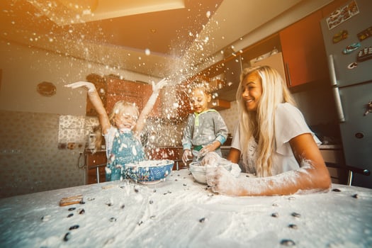 Mother with kids on kitchen photo