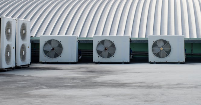 Air compressor on rooftop building photo