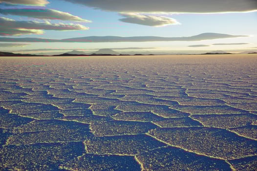 Gorgeous patterns on the surface of the salt flats of Salar de Uyuni, Bolivia, during sunset photo