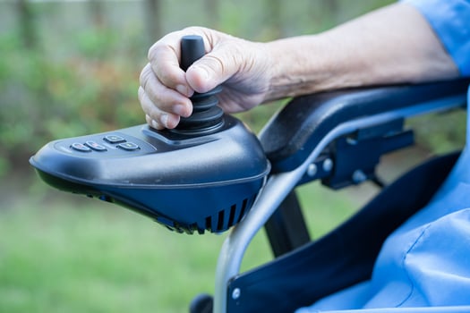 Asian senior or elderly old lady woman patient on electric wheelchair with remote control at nursing hospital ward, healthy strong medical concept photo