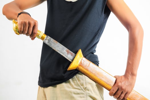 Man holding machete isolated photo