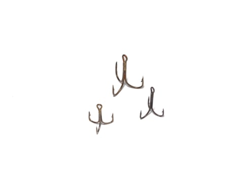 Triple hooks on a white background. Fishing. photo