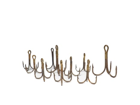 Triple hooks on a white background. Fishing. photo