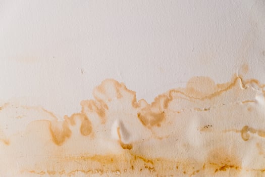 Water damaged ceiling roof, brown stain, office building photo