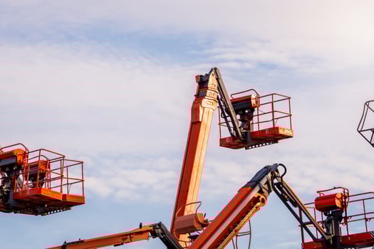 Articulated boom lift. Aerial platform lift. Telescopic boom lift against blue sky. Mobile construction crane for rent and sale. Maintenance and repair hydraulic boom lift service. Crane dealership. photo