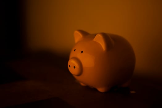 Piggy bank. Figure of pig for folding money. Symbol of financial well-being. Figure of animal is made of porcelain. photo