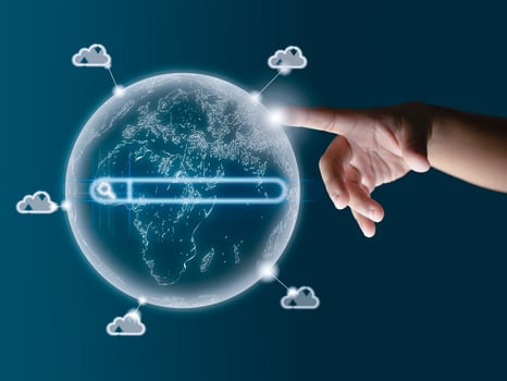 The human finger points to the world model. Displays data transfers around the world. The global cloud system, the global Internet system, communication. photo
