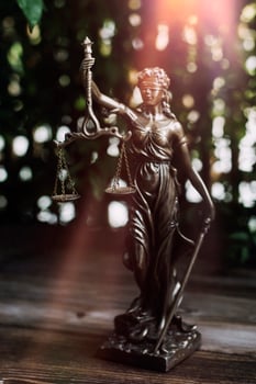 Business and lawyers discussing contract papers with brass scale on desk in office. Law, legal services, advice, justice and law concept picture with film grain effect photo