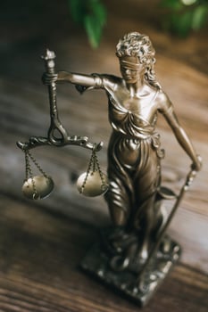 Business and lawyers discussing contract papers with brass scale on desk in office. Law, legal services, advice, justice and law concept picture with film grain effect photo