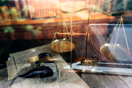 justice and law concept.Male judge in a courtroom on wooden table and Counselor or Male lawyer working in office. Legal law, advice and justice concept. photo