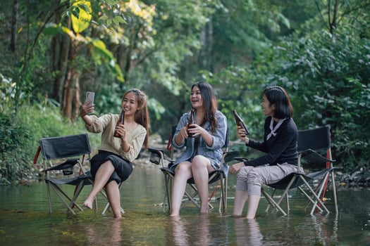 group of Asian girls enjoying a day at the  during holiday camping photo