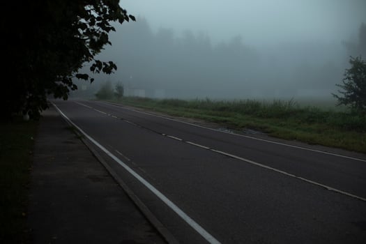 The road is in the fog. Highway without cars. photo