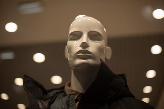 Men's mannequin in a jacket. Outerwear in the store. Showcase of men's clothing store. Details of modern fashion. photo