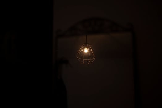 A lamp in a dark room. The gloomy lighting of the room. photo