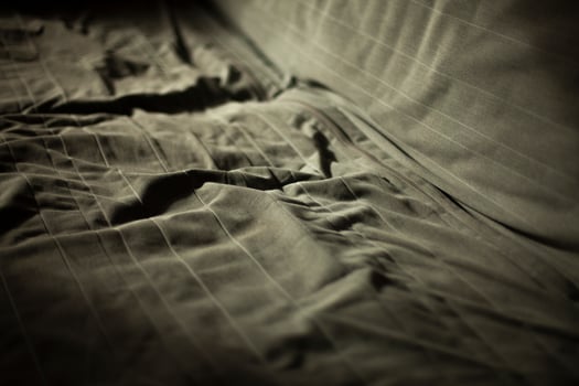Crutched sofa. Trace on the fabric. Bed in case. Furniture in the apartment. photo