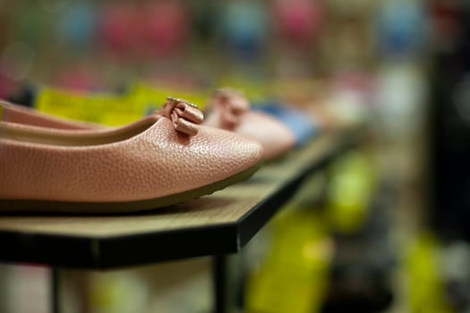 Shoes in the store. Details of the clothing store. photo