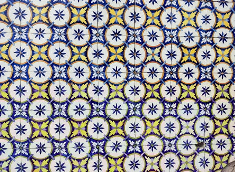Ancient azulejo tiles on the wall of an old house in Portugal. photo
