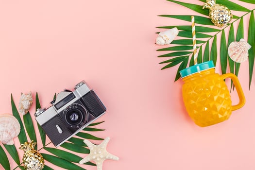 Tropical palm leaves vacations pink background photo