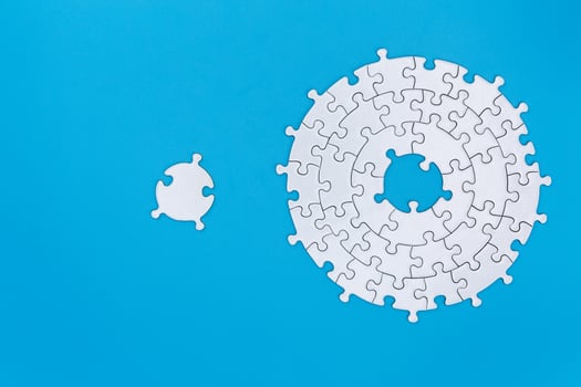 Unfinished white jigsaw puzzle pieces on blue background, The last piece of jigsaw puzzle, Copy space. photo