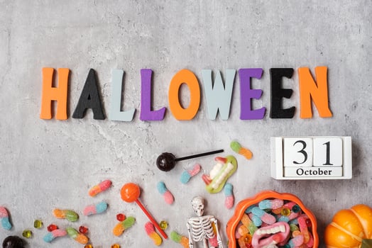 Happy Halloween day with ghost candies, pumpkin,  bowl and decorative. Trick or Threat, Hello October, fall autumn, Festive, party and holiday concept photo