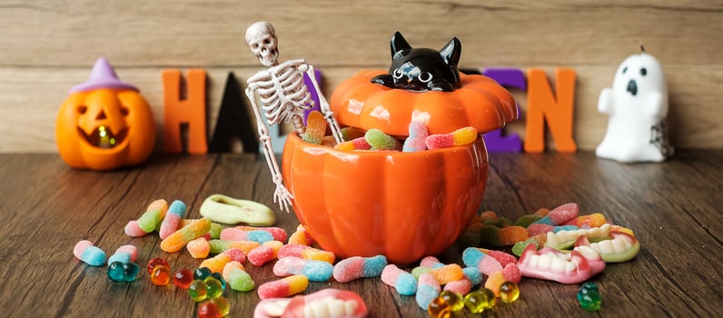 Happy Halloween day with ghost candies, pumpkin bowl, Jack O lantern and decorative. Trick or Threat, Hello October, fall autumn, Festive, party and holiday concept photo