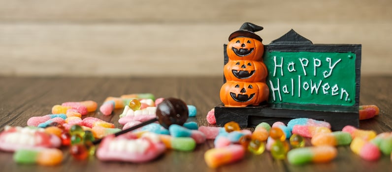 Happy Halloween day with ghost candies, pumpkin bowl, Jack O lantern and decorative. Trick or Threat, Hello October, fall autumn, Festive, party and holiday concept photo