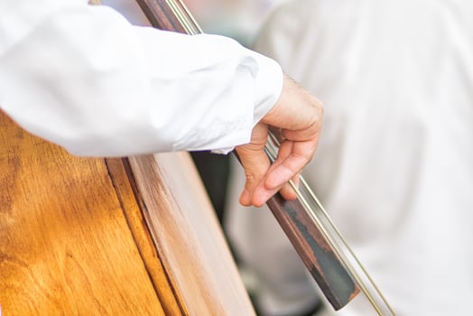 Fingers of double bass player photo