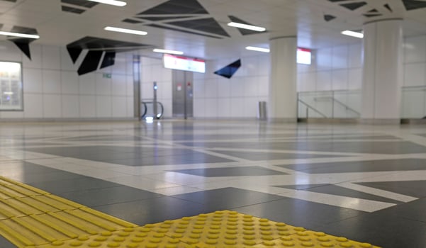 Subway station floor with pattern for blind people to follow photo