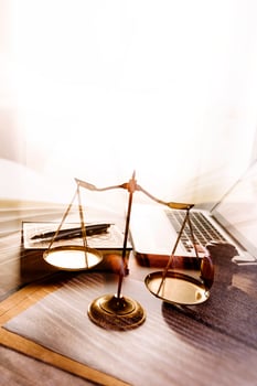 Business and lawyers discussing contract papers with brass scale on desk in office. Law, legal services, advice, justice and law concept picture with film grain effect photo