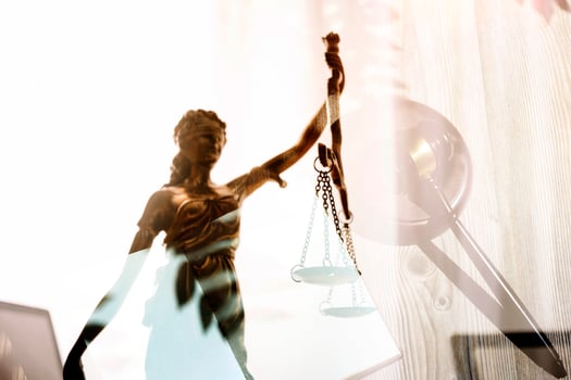 justice and law concept.Male judge in a courtroom on wooden table and Counselor or Male lawyer working in office. Legal law, advice and justice concept. photo