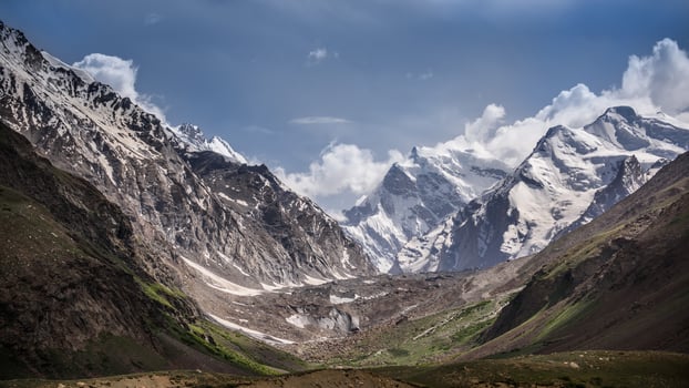 Moutain covered with snow and could bule sky photo