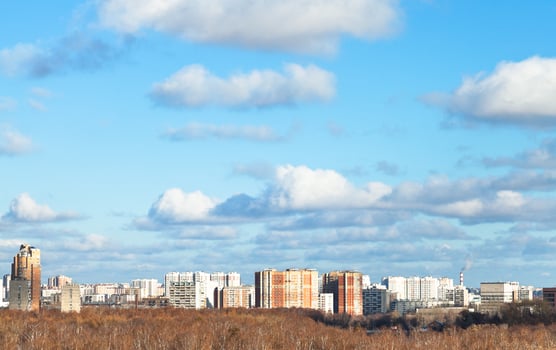 blue sky with white clouds over city in autumn day photo