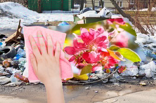 hand deletes urban dumpsters by pink cloth photo