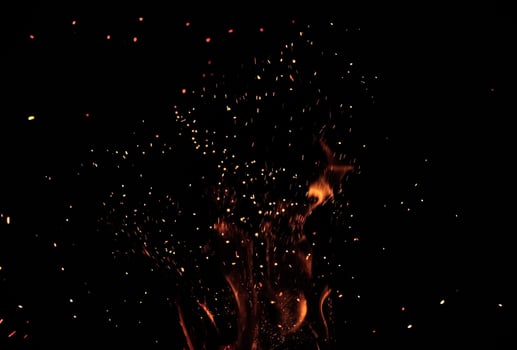 fire burning sparks particles overlay texture black background stock photo