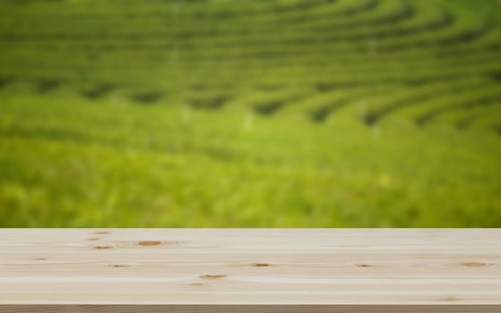 Empty wooden table with view of mountain or wooden desk with plantation nature with bokeh background, copy space for your text photo