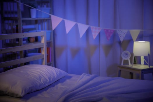 Positive minimalist and colorful room for kids and teenagers in a dark bedroom at night photo