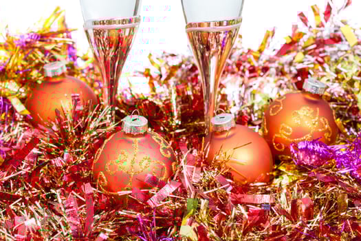 glasses at orange Xmas decorations close up photo