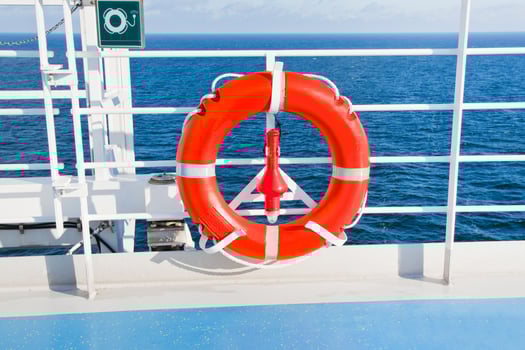 red life buoy on side of cruise liner photo