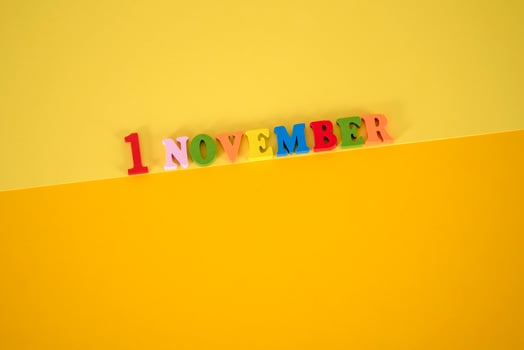 November 1st. Image of november 1 calendar on yellow background. Empty space for text photo