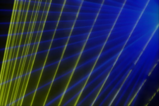 Colorful anniversary laser show with some smoke in the air. Party background photo