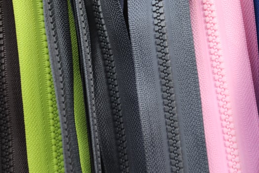 Detailed close up view on samples of cloth and fabrics in different colors found at a fabrics market photo