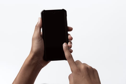 African-american person holding a mobile smartphone. Concept of black people. photo