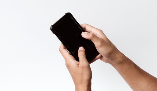 Asian person holding a mobile smartphone. photo