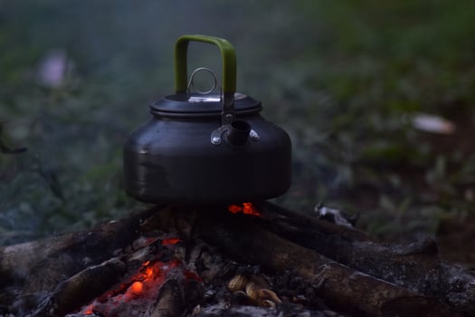 Tea pot on campfire photo
