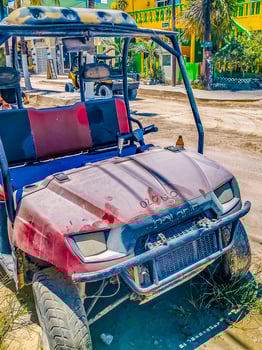 Holbox Quintana Roo Mexico 2022 Golf cart buggy cars carts muddy street village Holbox Mexico. photo