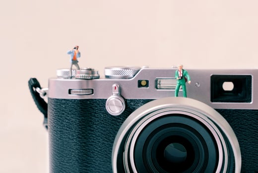 Miniature group of people photographer figures with camera, art photography concept photo