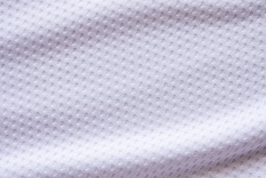 White fabric sport clothing football jersey with air mesh texture background photo
