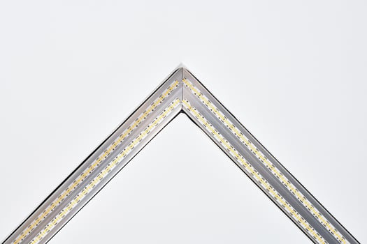 Strip LED lamp lighting with square aluminum profile on suspended ceiling in house, fragment, close photo